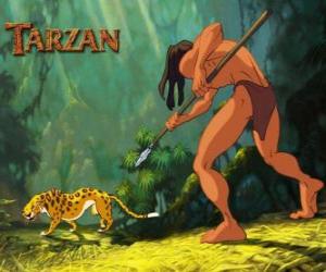 puzzel Tarzan te vechten met zijn speer tegen de grote sprong van een luipaard