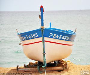 puzzel Boot aarding op het strand