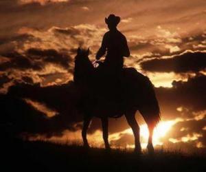 puzzel Cowboy rijden in de schemering