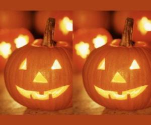 puzzel Halloween pompoenen gesneden met een gezicht en een brandende kaars in of Jack-o'lantern