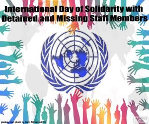 puzzel Internationale dag van solidariteit met die worden vastgehouden en ontbrekende medewerkers