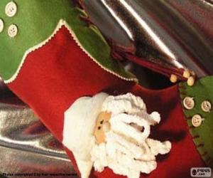 puzzel Kerst sok versierd met het gezicht Santa's en knoppen