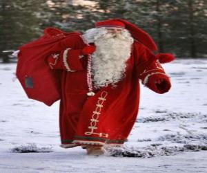 puzzel Kerstman of Santa dragen van een zak vol cadeaus