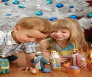 puzzel Kinderen spelen met de kribbe