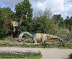 Groep van drie dinosauriërs in het landschap