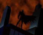 Batman kijken naar de stad vanaf het dak van een gebouw in Gotham City