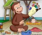 De nieuwsgierige aap George maakt marionetten