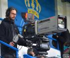 Cameraman van televisie tijdens een uitzending van een sportevenement
