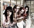 Vier meisjes vermomd als zombie te vieren het feest van Halloween