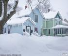 Twee besneeuwde huizen