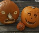 Drie Halloween pompoenen