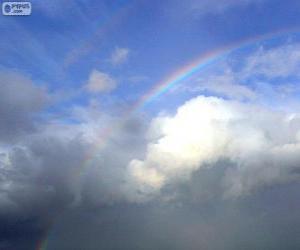 puzzel Regenboog tussen wolken